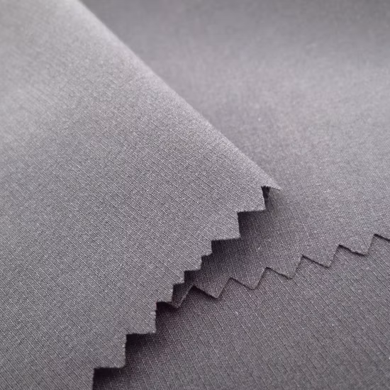 Tejido reciclado elástico al aire libre poliéster/Nylon/Spandex tejido Jacquard impermeable para prendas de vestir uniforme chaqueta abrigo
